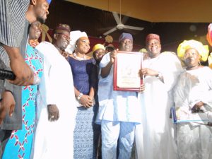 EROGBOGBO, FLANKED BY WIFE, ROTIMI OGUNLEYE, LAGOS STATE COMMISSIONER FOR COMMERCE & COOPERATIVES AND OTHER GUESTS